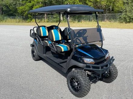 Lifted four passenger golf cart with custom striped seats
