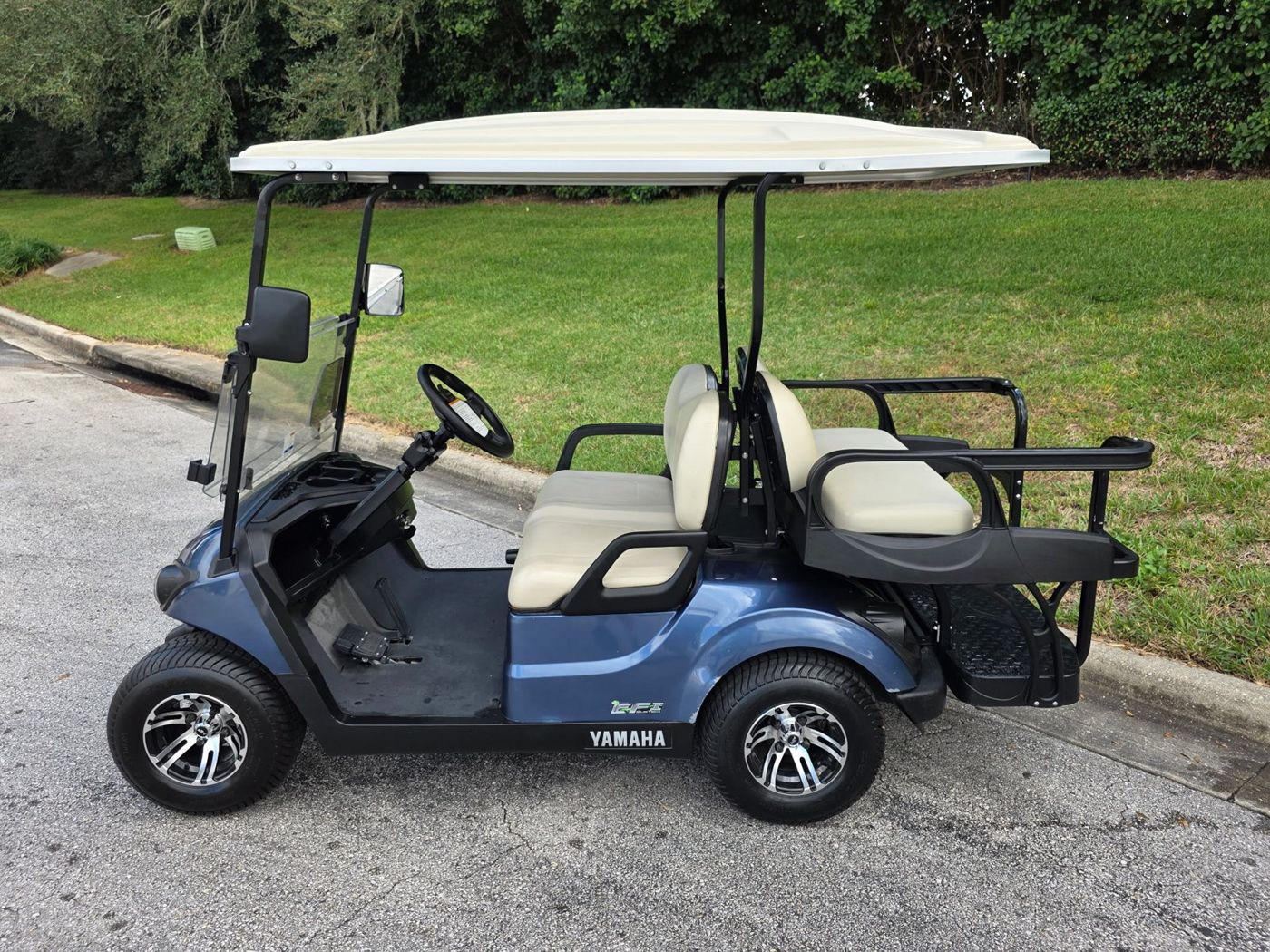 Blue Yamaha four passenger golf cart